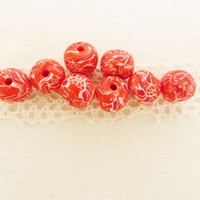 Perle ronde fleurie rouge