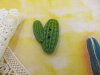 Bouton cactus vert branche gauche