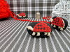 Bouton ovale noir tortue rouge