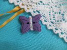 Bouton papillon violet
