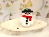 Bouton petit bonhomme de neige echarpe rouge