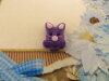 Bouton tête de lapin violet pailleté