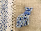 Bouton chat bleu et beige