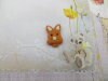 Bouton tête de lapin ocre