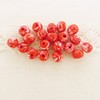 Perle ronde fleurie rouge