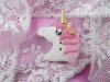 Bouton tête de licorne rose