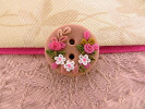 Bouton rond rose fleuri