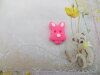 Bouton tête de lapin rose fluo