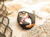 Bouton ovale pingouin
