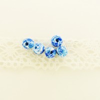 Perle ronde fleurie bleue