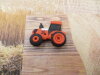 Bouton tracteur orange Kubota
