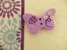 Bouton papillon violet