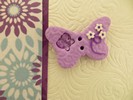 Bouton papillon violet